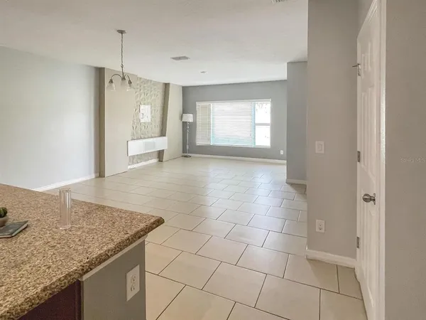 a kitchen with granite countertop a sink and a stove