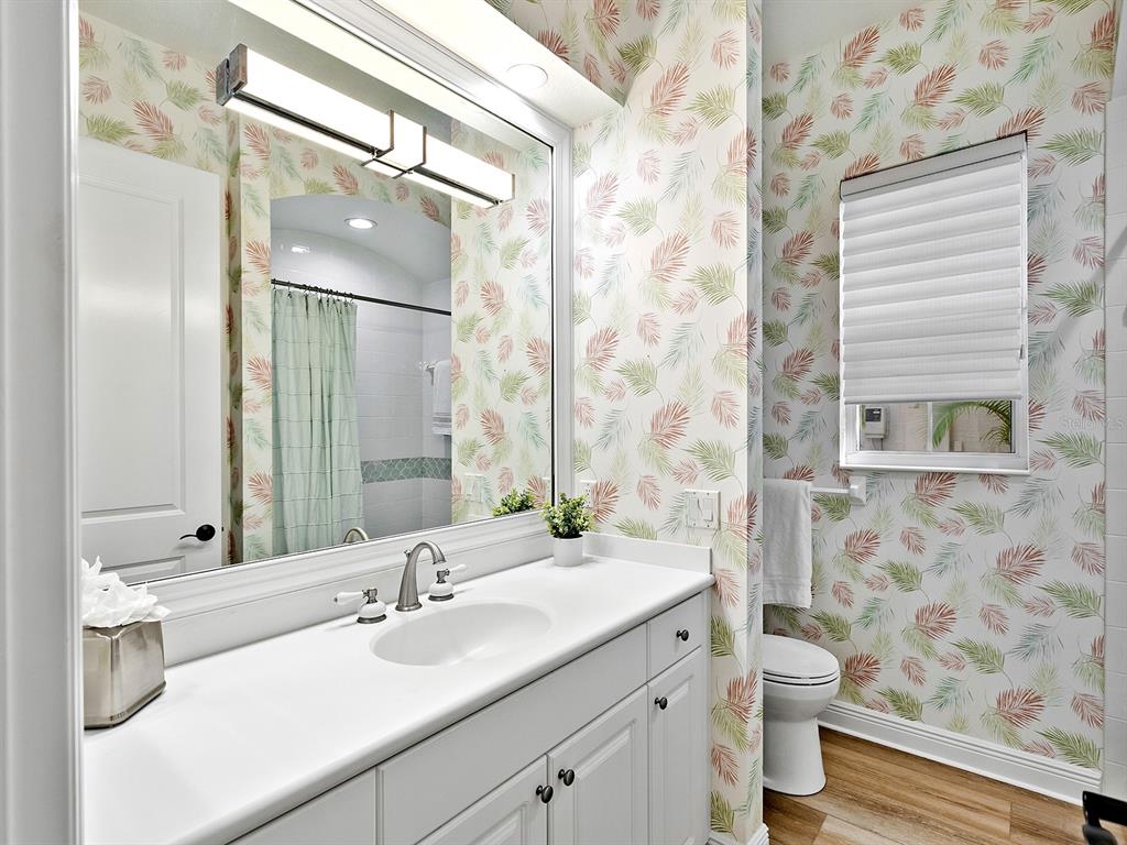 7431 Greystone Street Lakewood Ranch, FL 34202 - Photo 45 of 85 a bathroom with a sink a toilet and a mirror