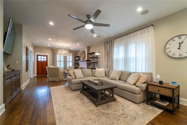 a large kitchen with stainless steel appliances granite countertop a lot of counter space and wooden floors