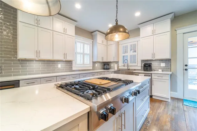 a bathroom with a sink a toilet and bathtub