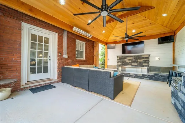 a view of a house with a yard and sitting area