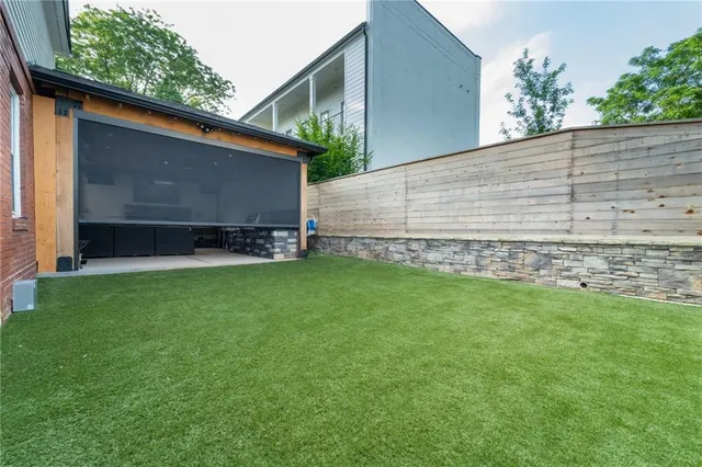 view of house with backyard