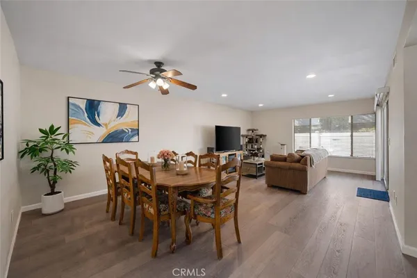 a view of a dining room with furniture window and wooden floor