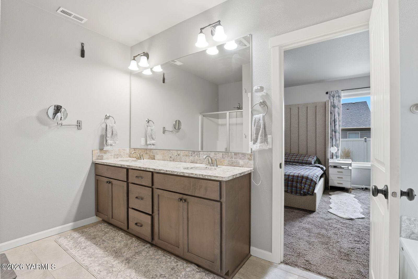 104 Bravo Street Moxee, WA 98936 - Photo 13 of 27 a bathroom with a sink double vanity and a mirror