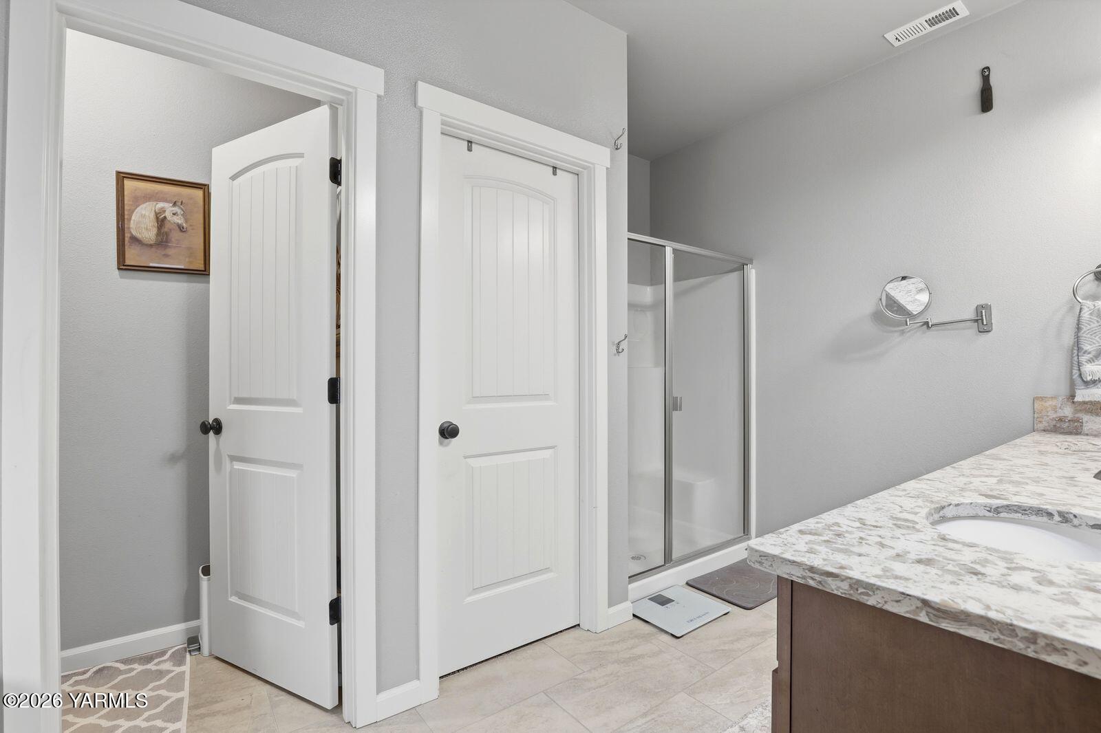 104 Bravo Street Moxee, WA 98936 - Photo 14 of 27 a bathroom with a granite countertop sink and shower