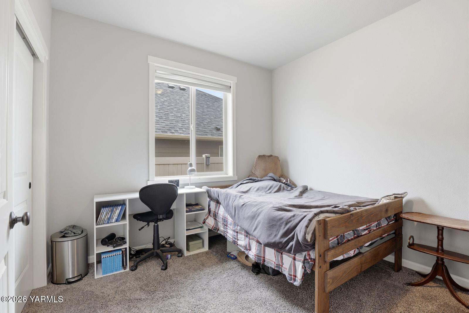 104 Bravo Street Moxee, WA 98936 - Photo 16 of 27 a bedroom with a bed and a window