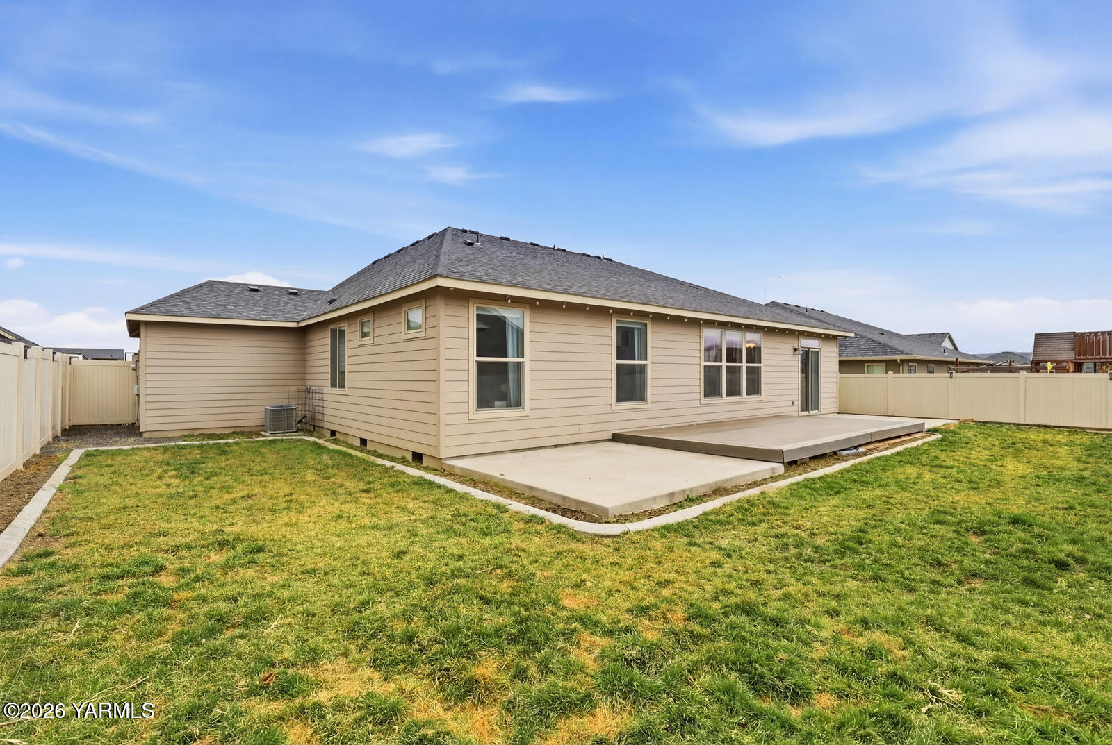 104 Bravo Street Moxee, WA 98936 - Photo 21 of 27 a view of a house with a backyard