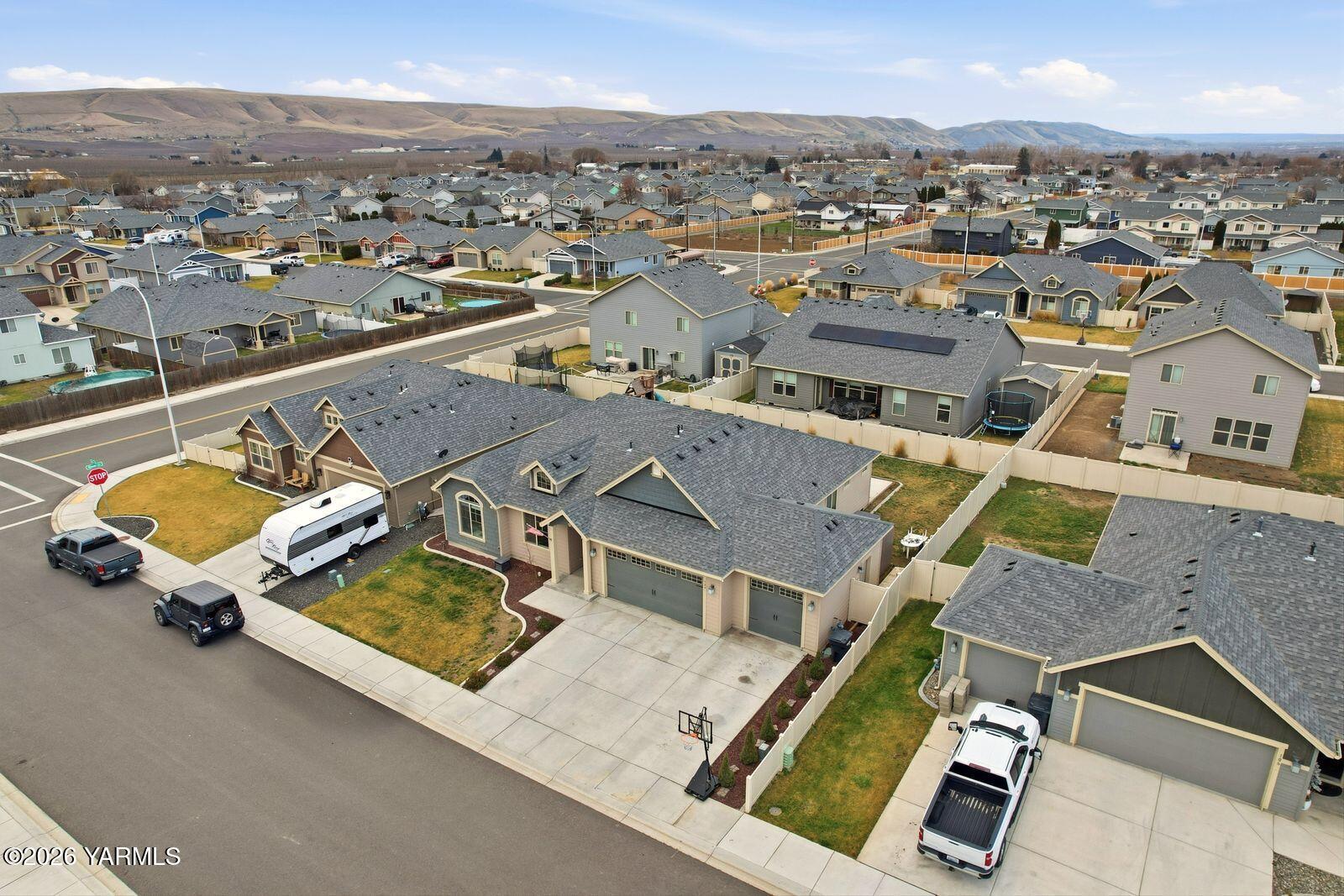 104 Bravo Street Moxee, WA 98936 - Photo 22 of 27 an aerial view of residential house with parking space and city view