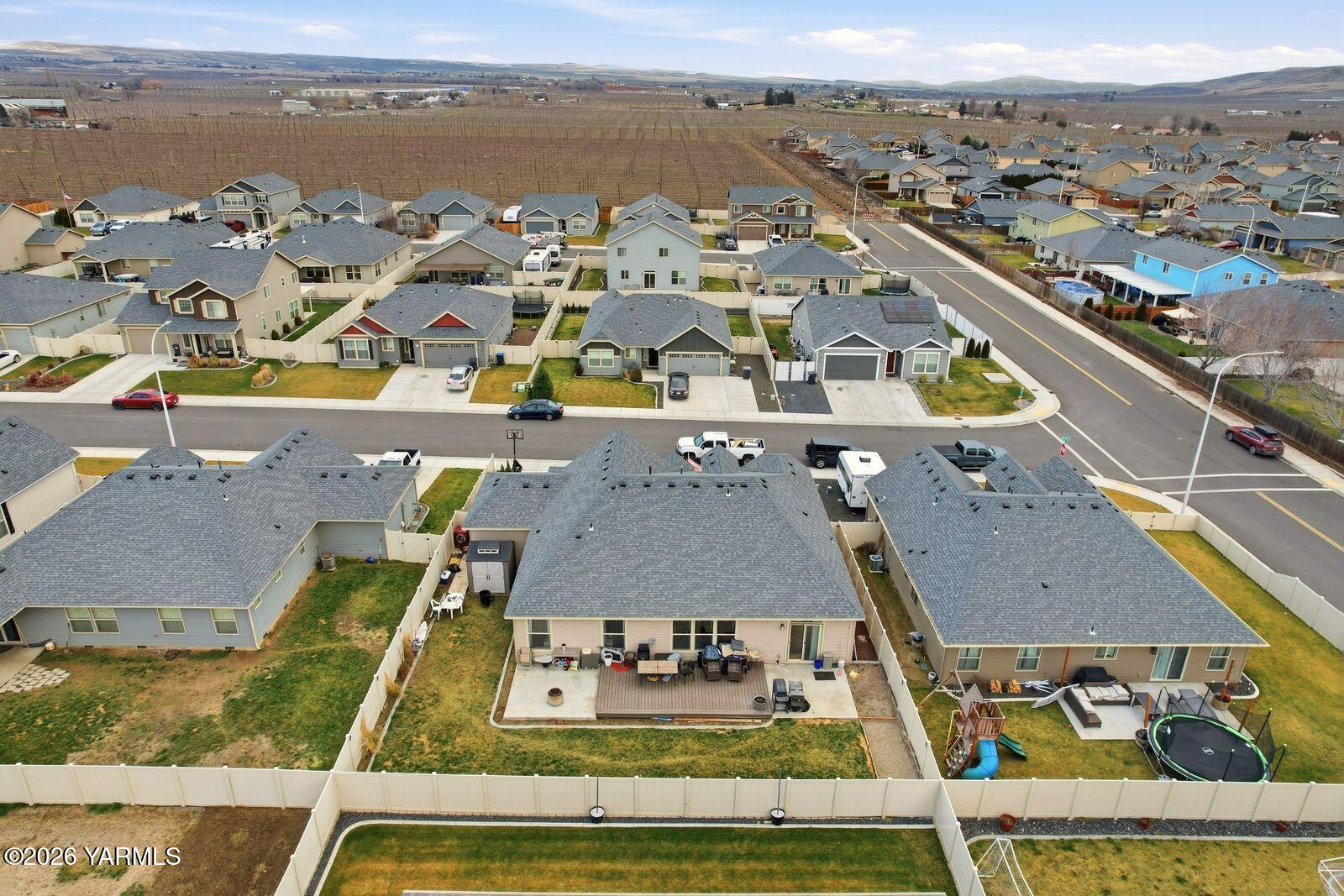 104 Bravo Street Moxee, WA 98936 - Photo 24 of 27 an aerial view of a residential building with ocean view