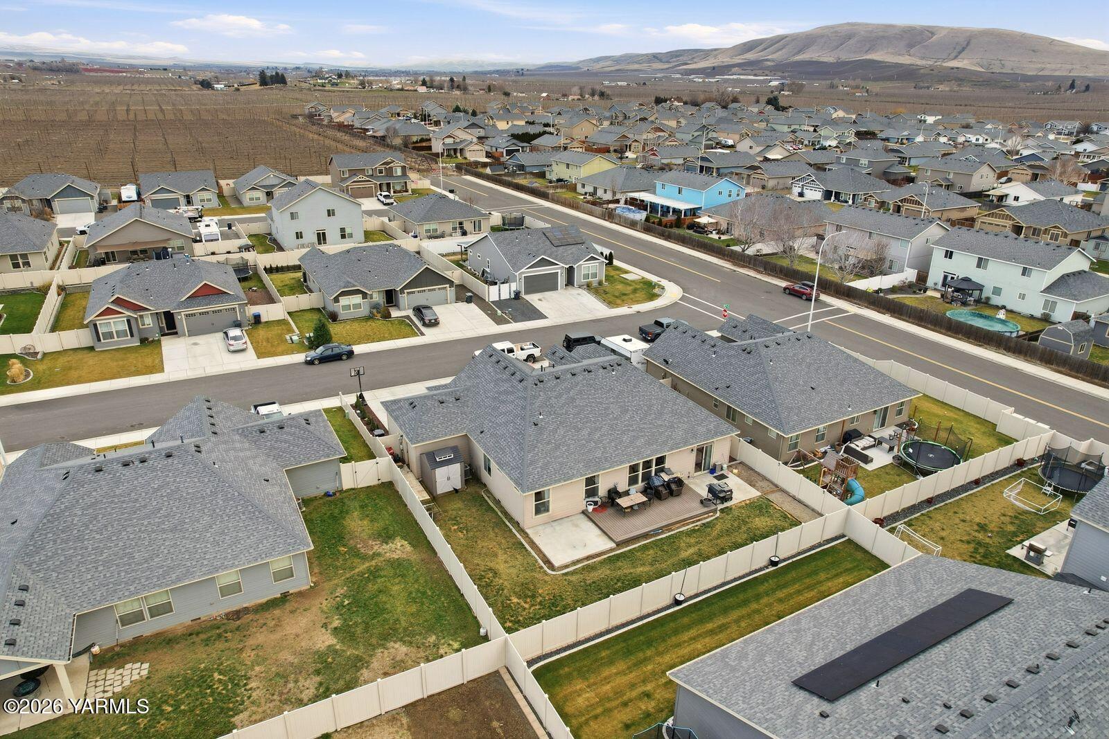 104 Bravo Street Moxee, WA 98936 - Photo 25 of 27 an aerial view of residential houses with outdoor space