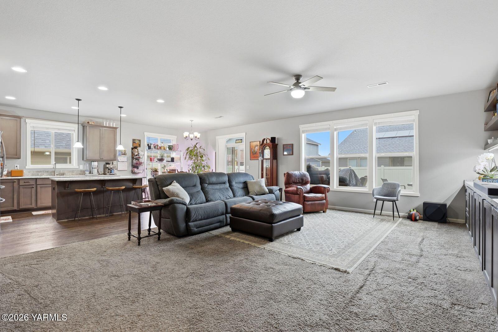 104 Bravo Street Moxee, WA 98936 - Photo 6 of 27 a living room with furniture and a large window