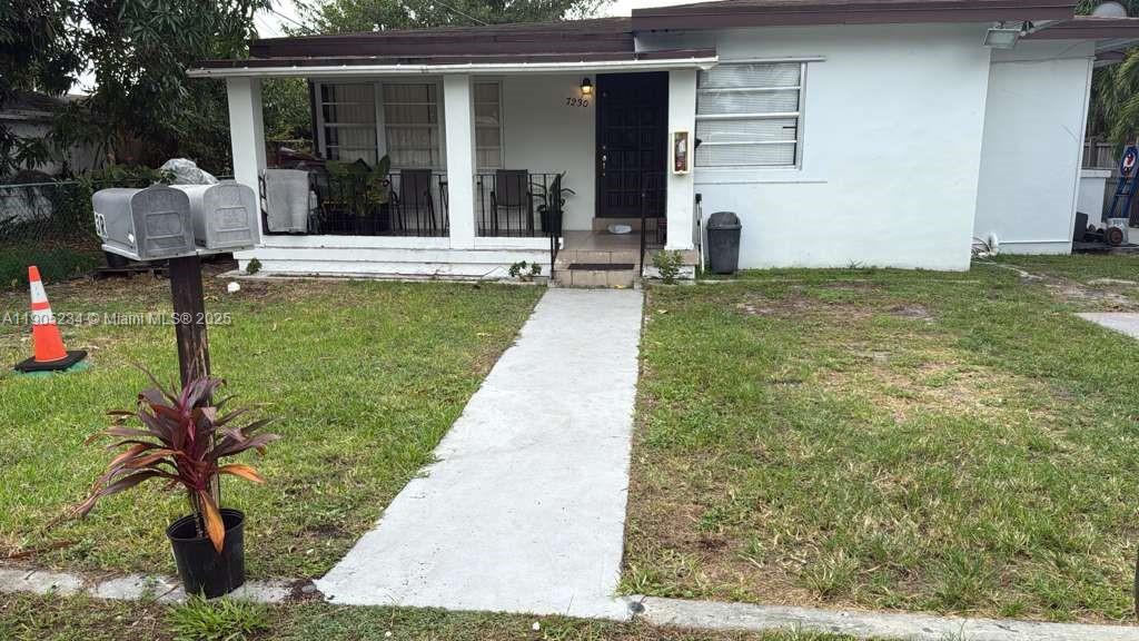 7230 Northwest 3rd Street, Unit 4 Miami, FL 33126 - Photo 1 of 13 a view of a patio with table and chairs potted plants