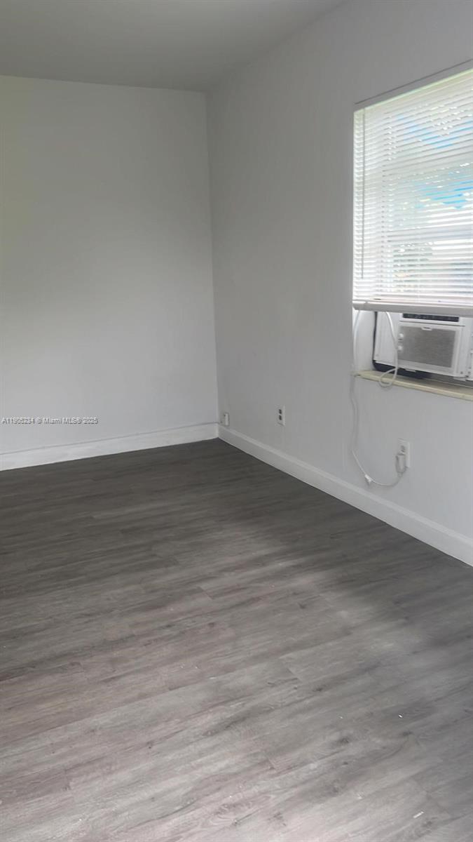 7230 Northwest 3rd Street, Unit 4 Miami, FL 33126 - Photo 11 of 13 a view of empty room with wooden floor and fan