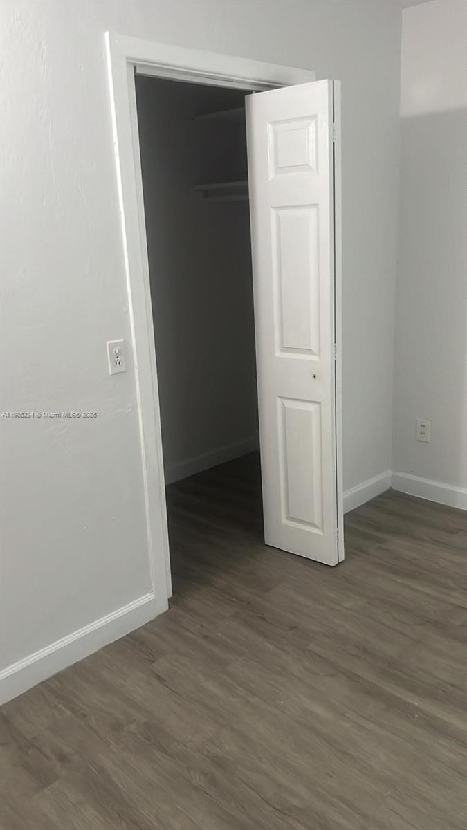 7230 Northwest 3rd Street, Unit 4 Miami, FL 33126 - Photo 13 of 13 an empty room with wooden floor