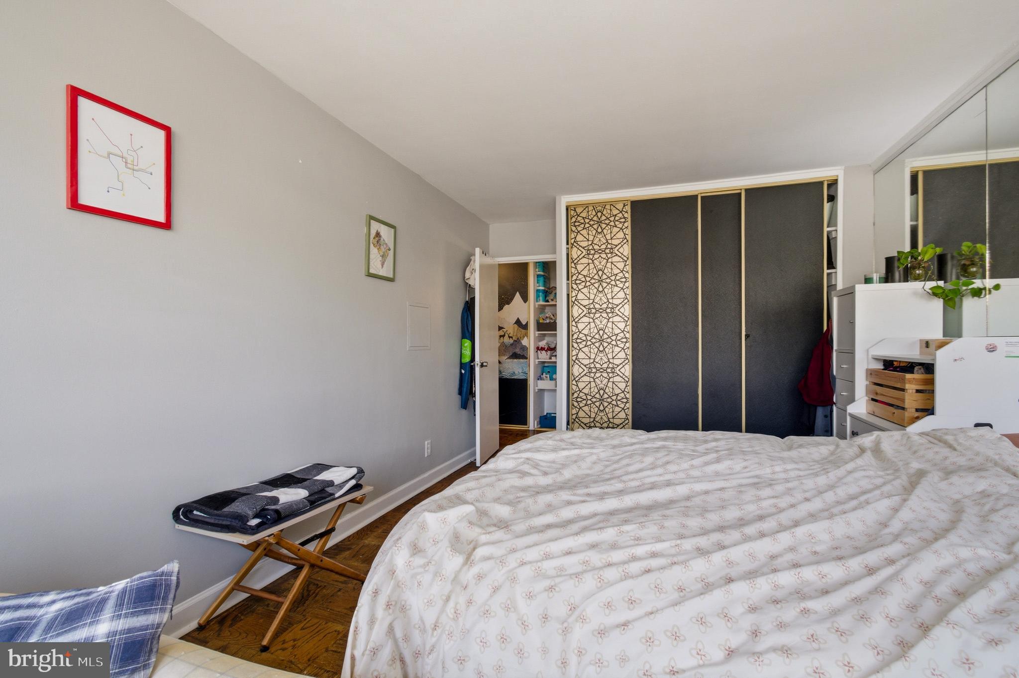 400 O Street Southwest, Unit 402 Washington, DC 20024 - Photo 16 of 34 a bedroom with a bed and wooden floor