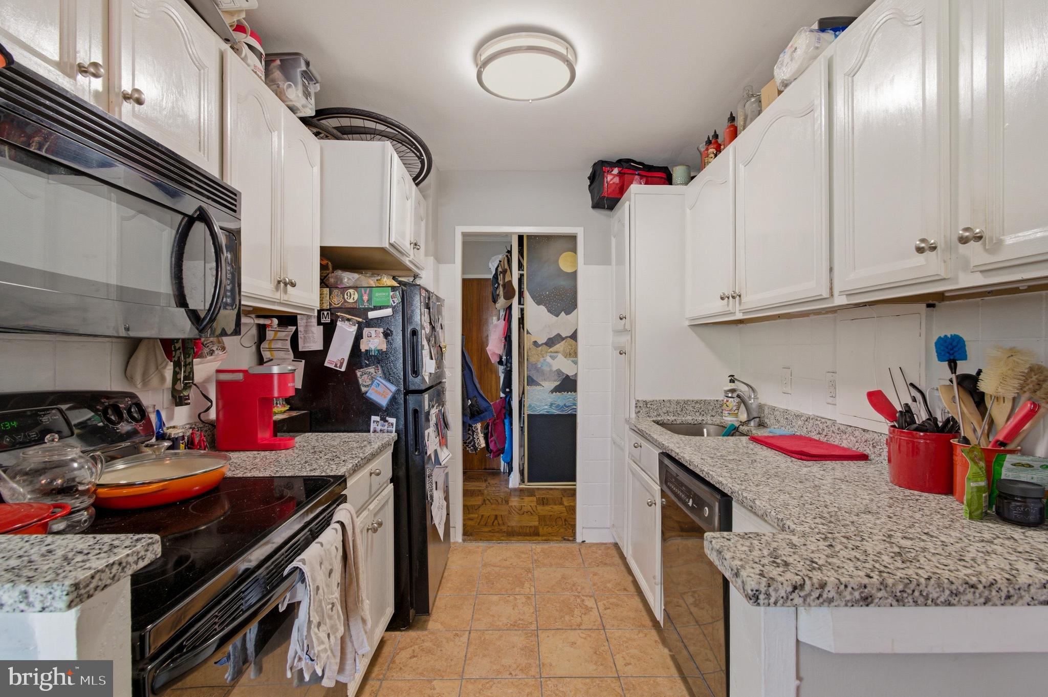 400 O Street Southwest, Unit 402 Washington, DC 20024 - Photo 23 of 34 a kitchen with stainless steel appliances granite countertop a sink and cabinets