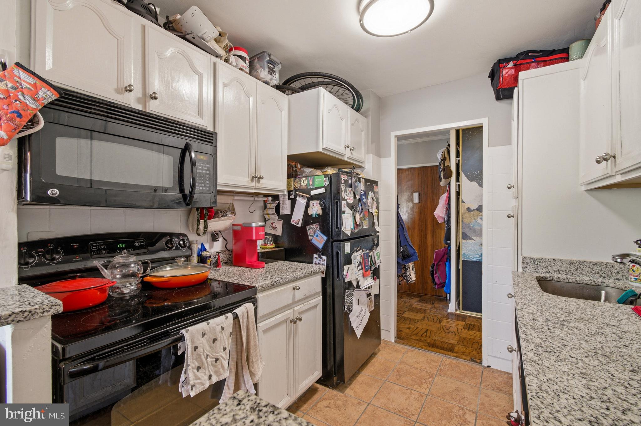 400 O Street Southwest, Unit 402 Washington, DC 20024 - Photo 24 of 34 a kitchen with stainless steel appliances granite countertop a stove and a sink