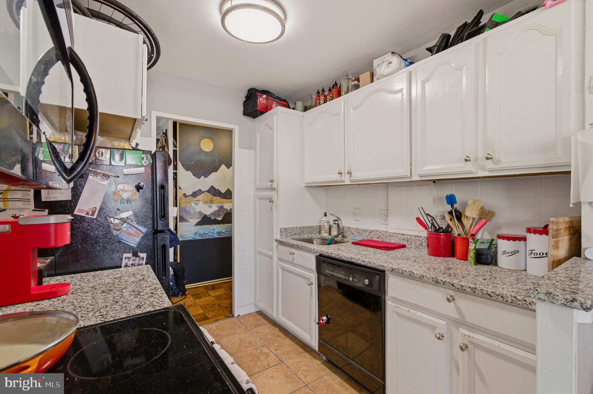 400 O Street Southwest, Unit 402 Washington, DC 20024 - Photo 25 of 34 a kitchen with stainless steel appliances granite countertop a sink dishwasher stove and cabinets