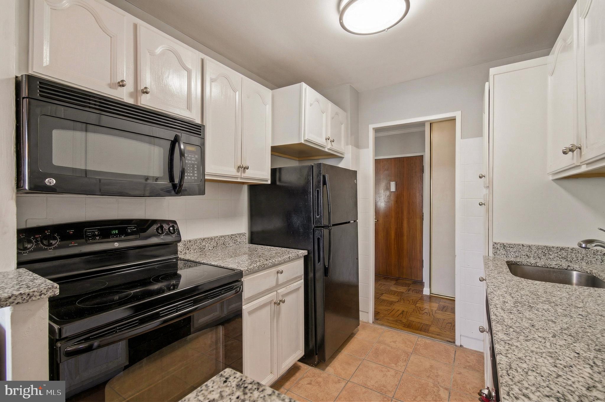 400 O Street Southwest, Unit 402 Washington, DC 20024 - Photo 5 of 34 a kitchen with a stove microwave and refrigerator