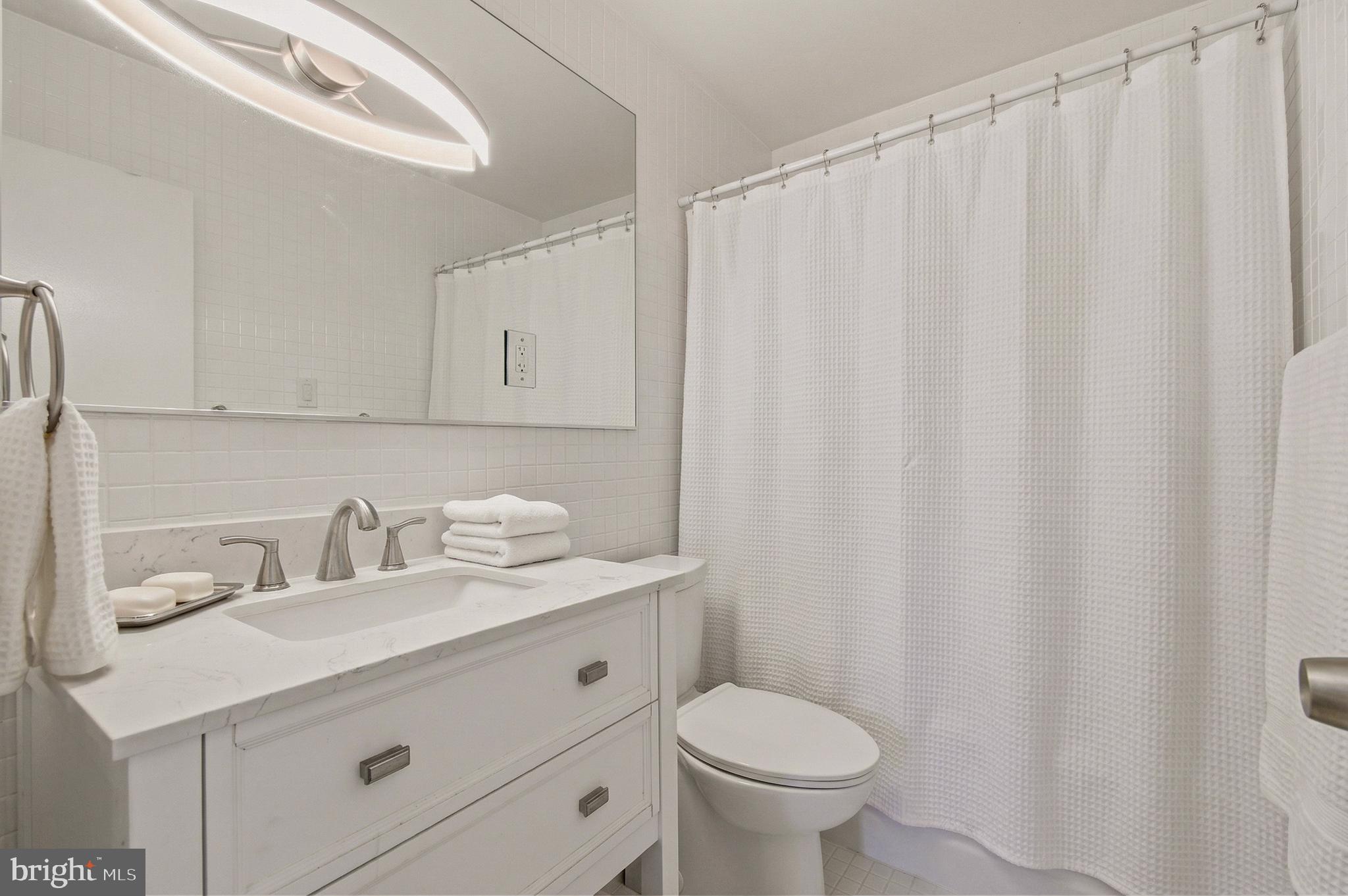 400 O Street Southwest, Unit 402 Washington, DC 20024 - Photo 6 of 34 a bathroom with a sink and a toilet