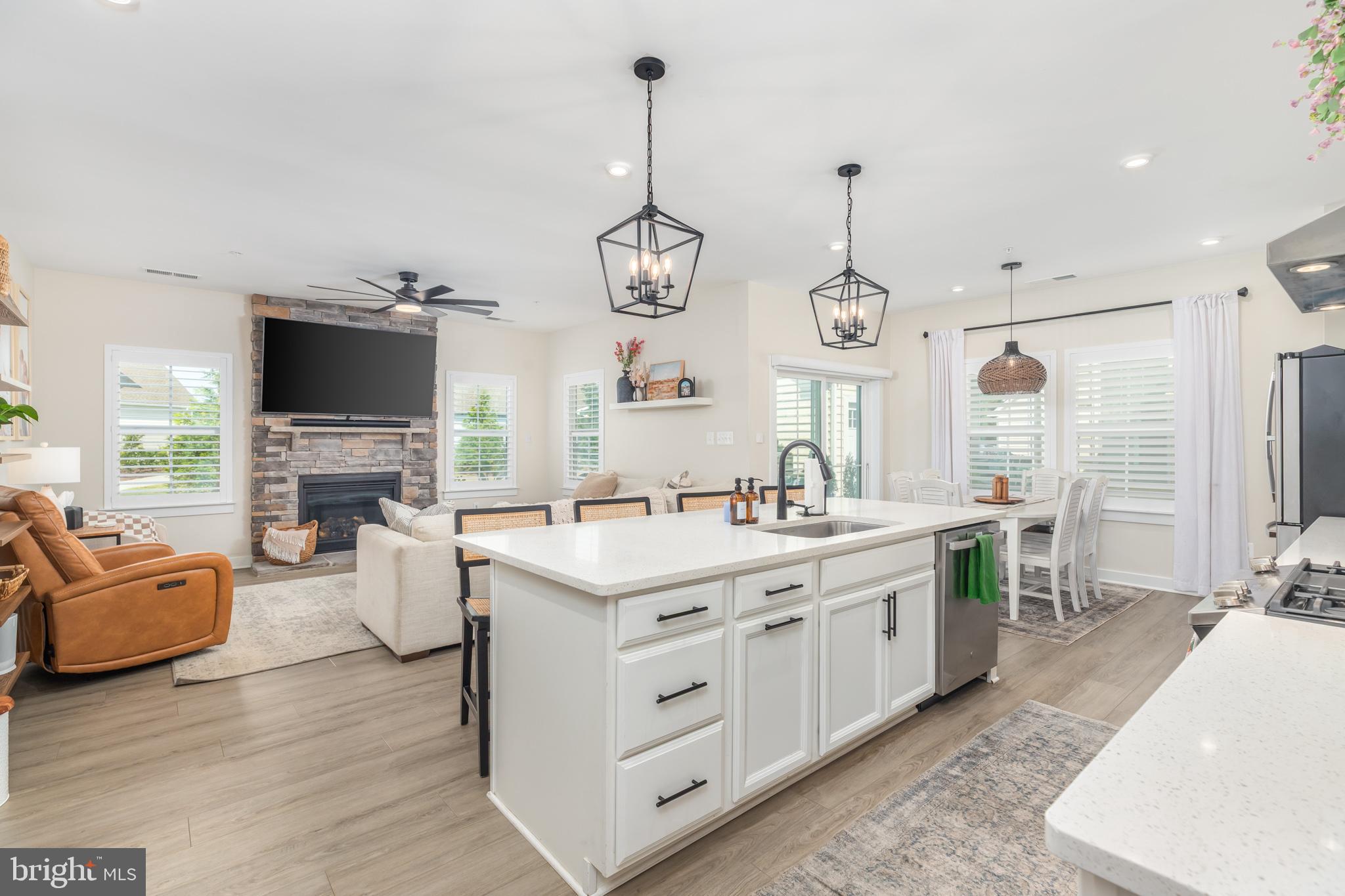 12125 Snug Harbor Road Berlin, MD 21811 - Photo 22 of 52 a view of living room with granite countertop furniture and fireplace