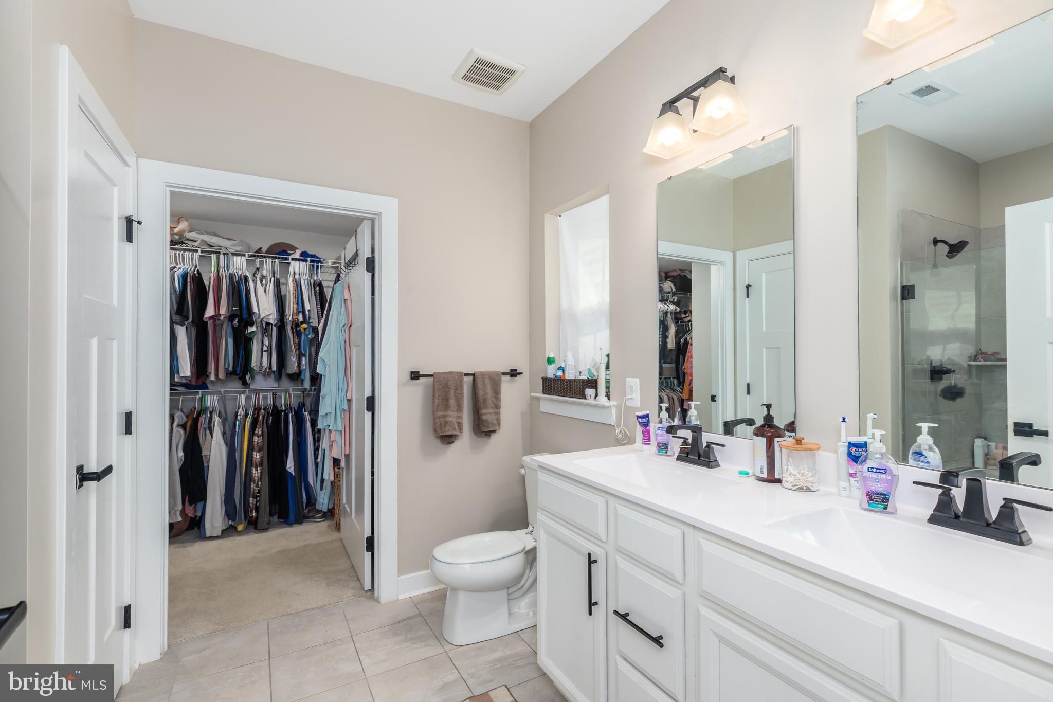 12125 Snug Harbor Road Berlin, MD 21811 - Photo 35 of 52 a bathroom with a sink a toilet and shower