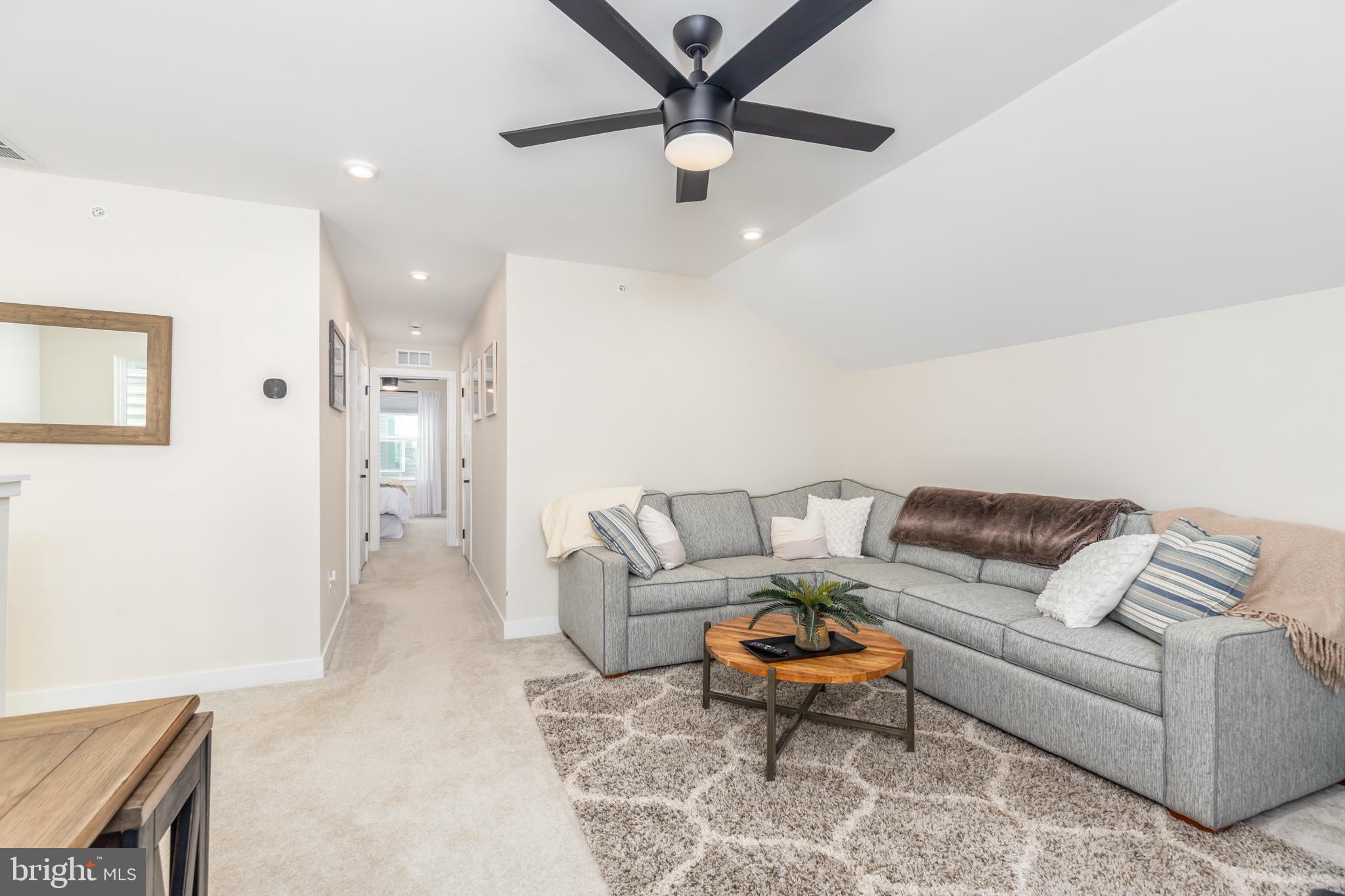 12125 Snug Harbor Road Berlin, MD 21811 - Photo 40 of 52 a living room with furniture and a rug