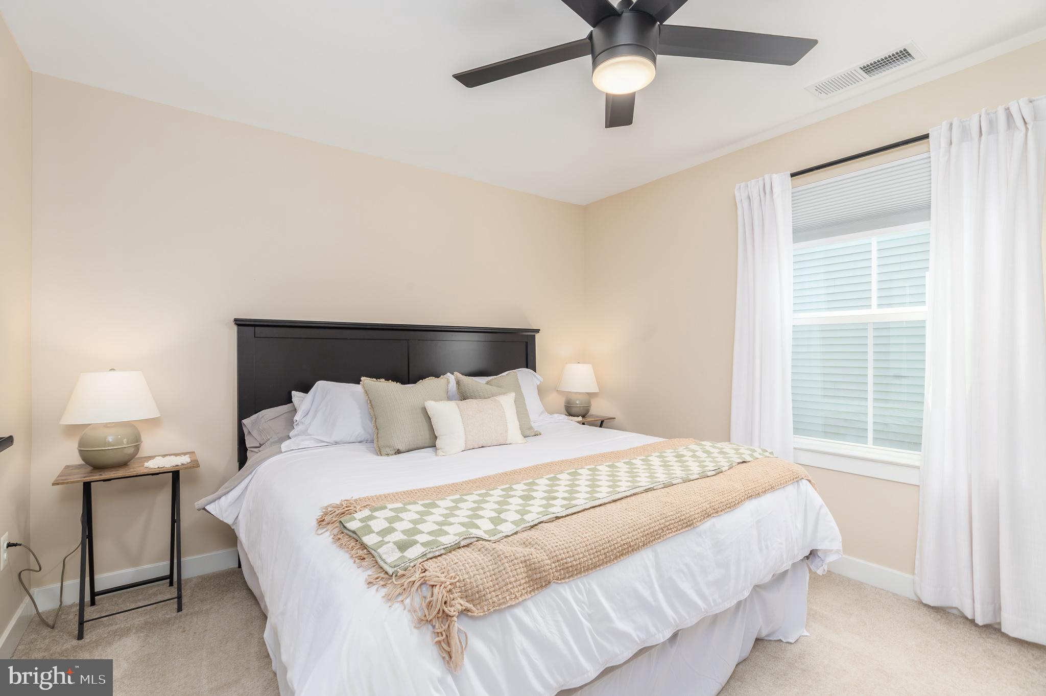12125 Snug Harbor Road Berlin, MD 21811 - Photo 41 of 52 a bedroom with a bed and window