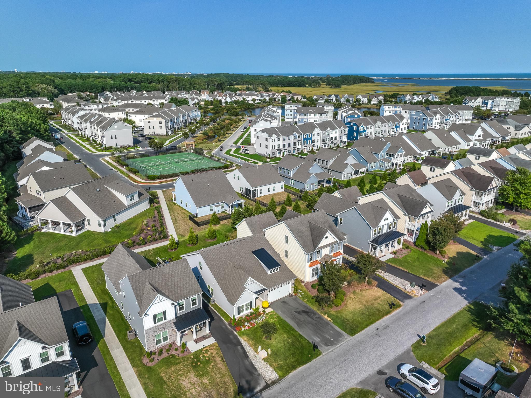 12125 Snug Harbor Road Berlin, MD 21811 - Photo 47 of 52 an aerial view of residential houses with outdoor space and ocean view