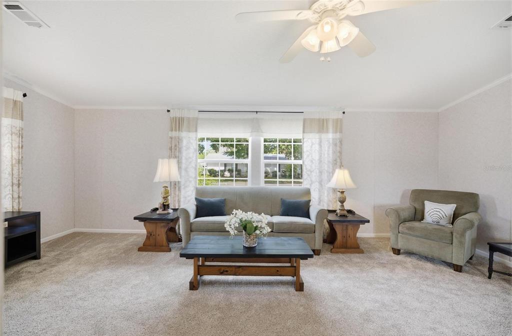 55716 Keith Street Astor, FL 32102 - Photo 11 of 32 a living room with furniture and a large window