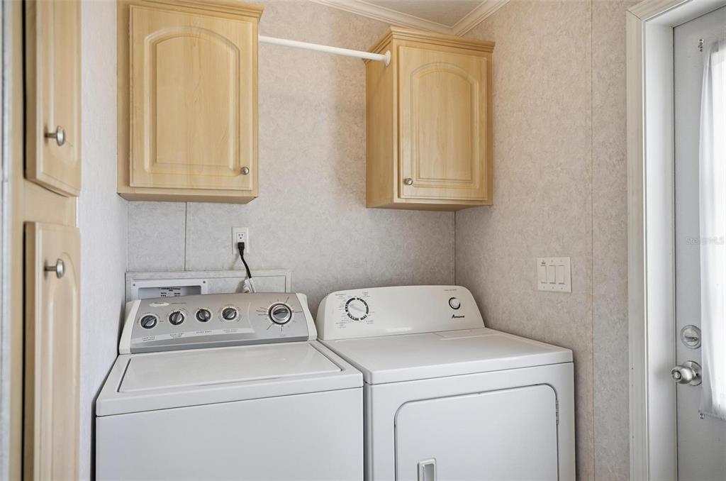 55716 Keith Street Astor, FL 32102 - Photo 18 of 32 a utility room with dryer and washer