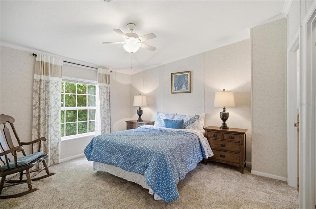 55716 Keith Street Astor, FL 32102 - Photo 20 of 32 a bedroom with a bed and a window
