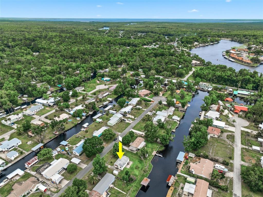 55716 Keith Street Astor, FL 32102 - Photo 2 of 32 a view of a city with an ocean