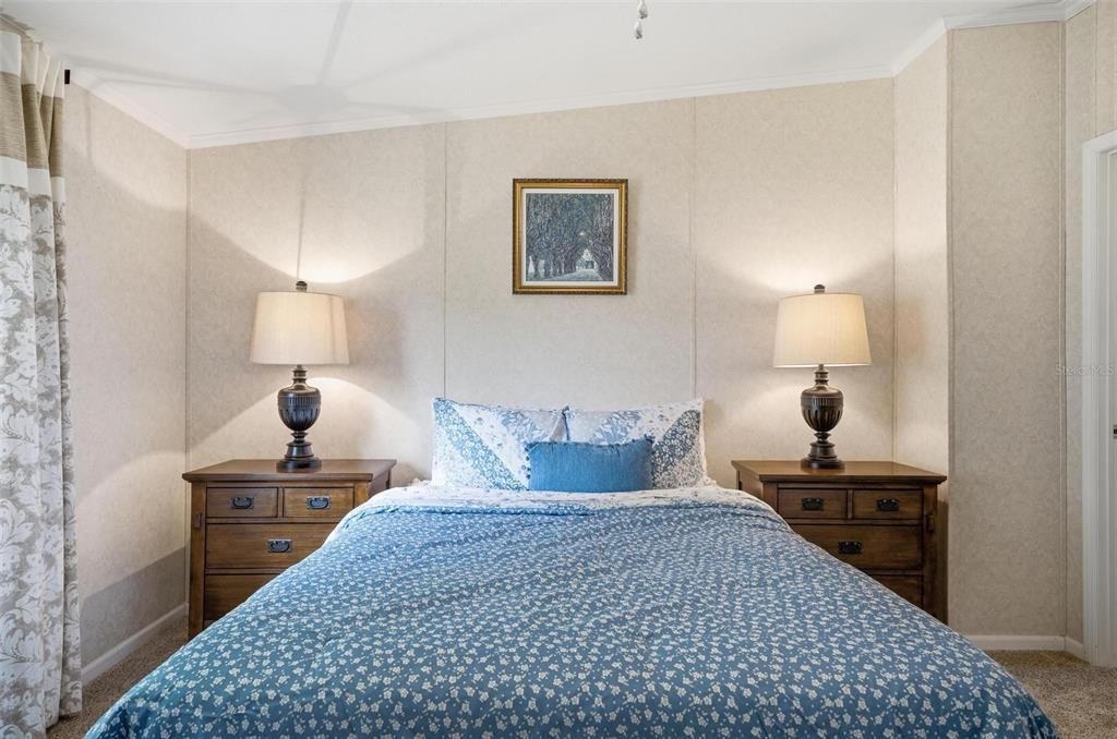 55716 Keith Street Astor, FL 32102 - Photo 22 of 32 a bedroom with a bed and a lamp