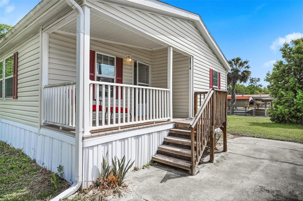 55716 Keith Street Astor, FL 32102 - Photo 6 of 32 a view of a house with backyard and wooden fence