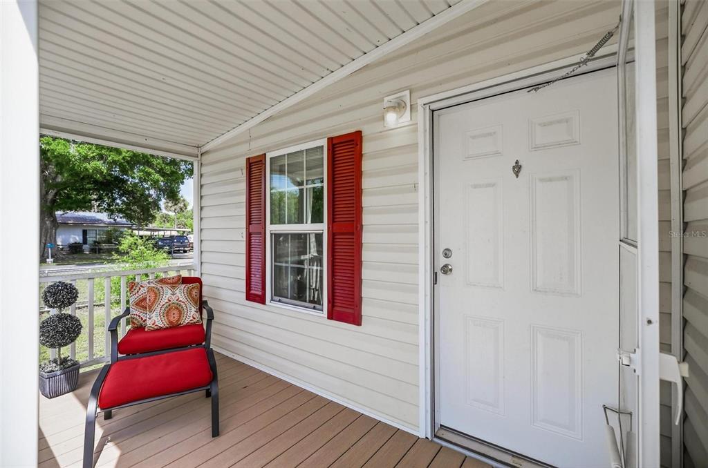 55716 Keith Street Astor, FL 32102 - Photo 7 of 32 a porch with furniture and window