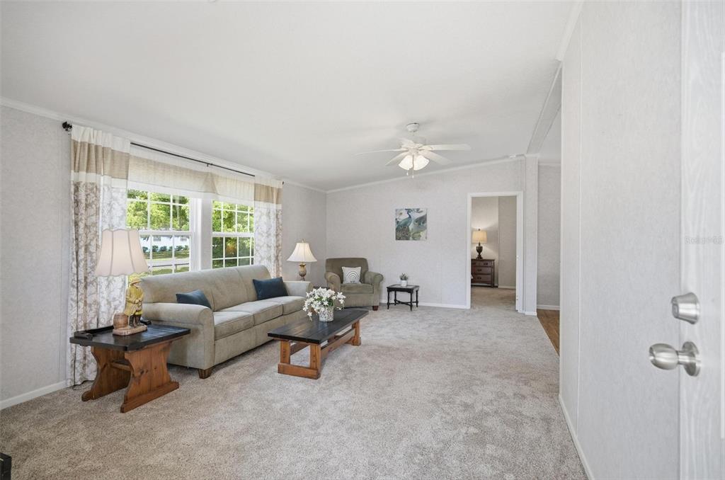 55716 Keith Street Astor, FL 32102 - Photo 8 of 32 a living room with furniture and a large window