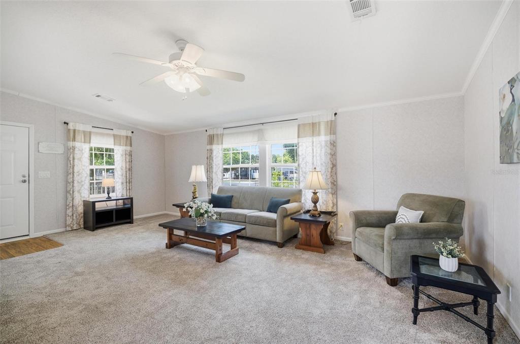 55716 Keith Street Astor, FL 32102 - Photo 9 of 32 a living room with furniture and a window