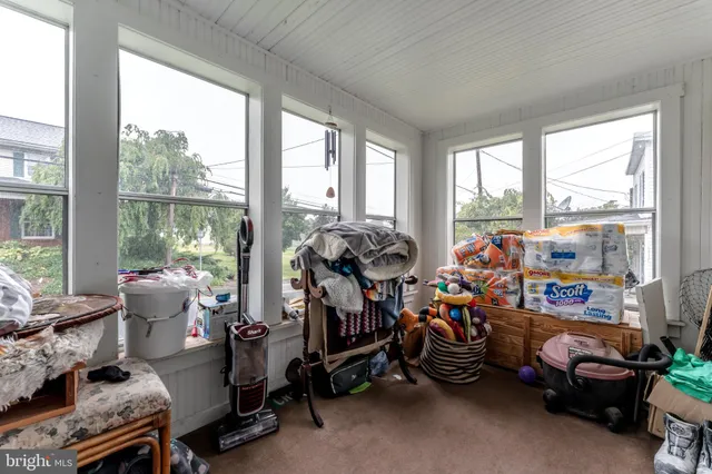 a view of a house with a yard and tree s