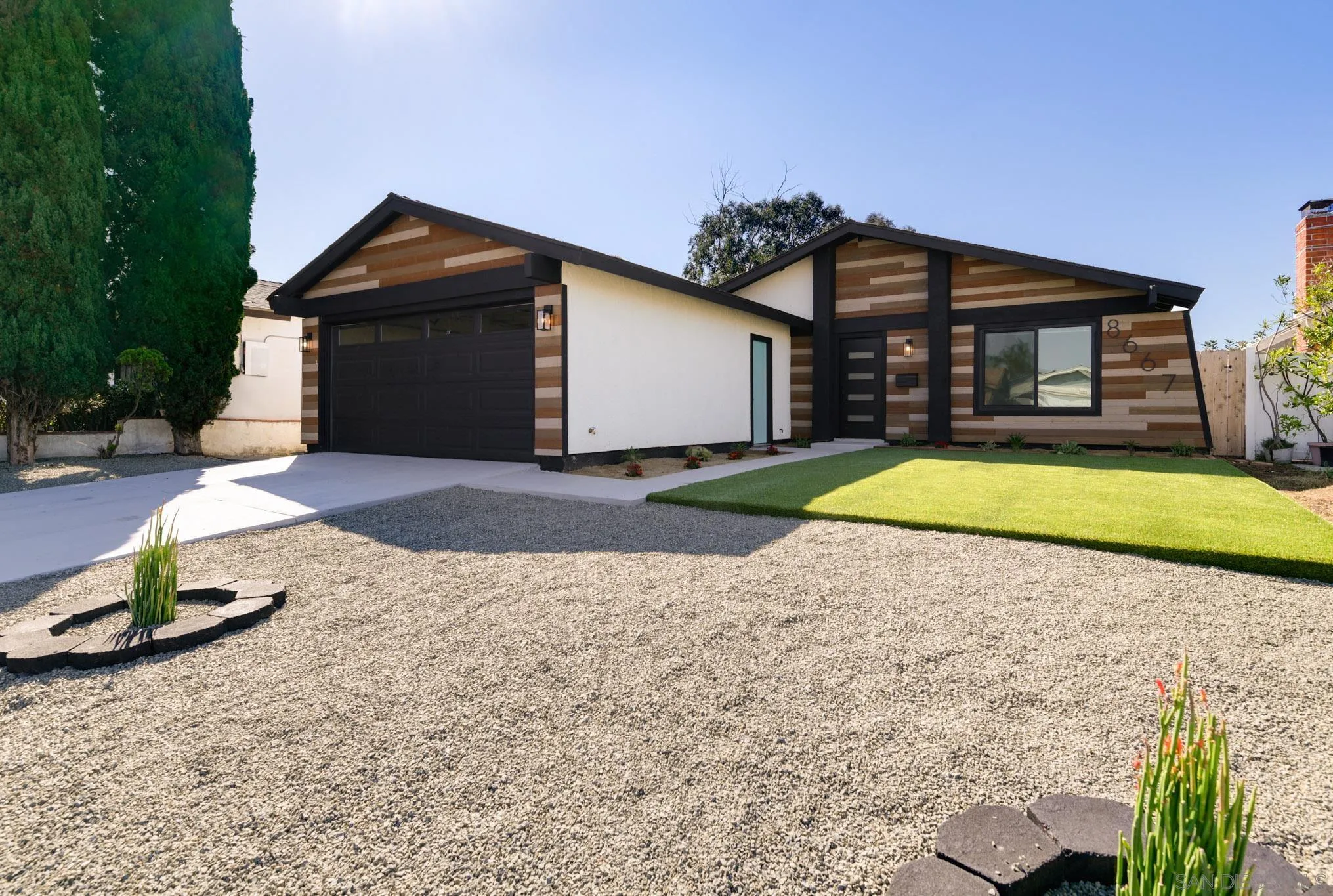 a house with swimming pool in front of it