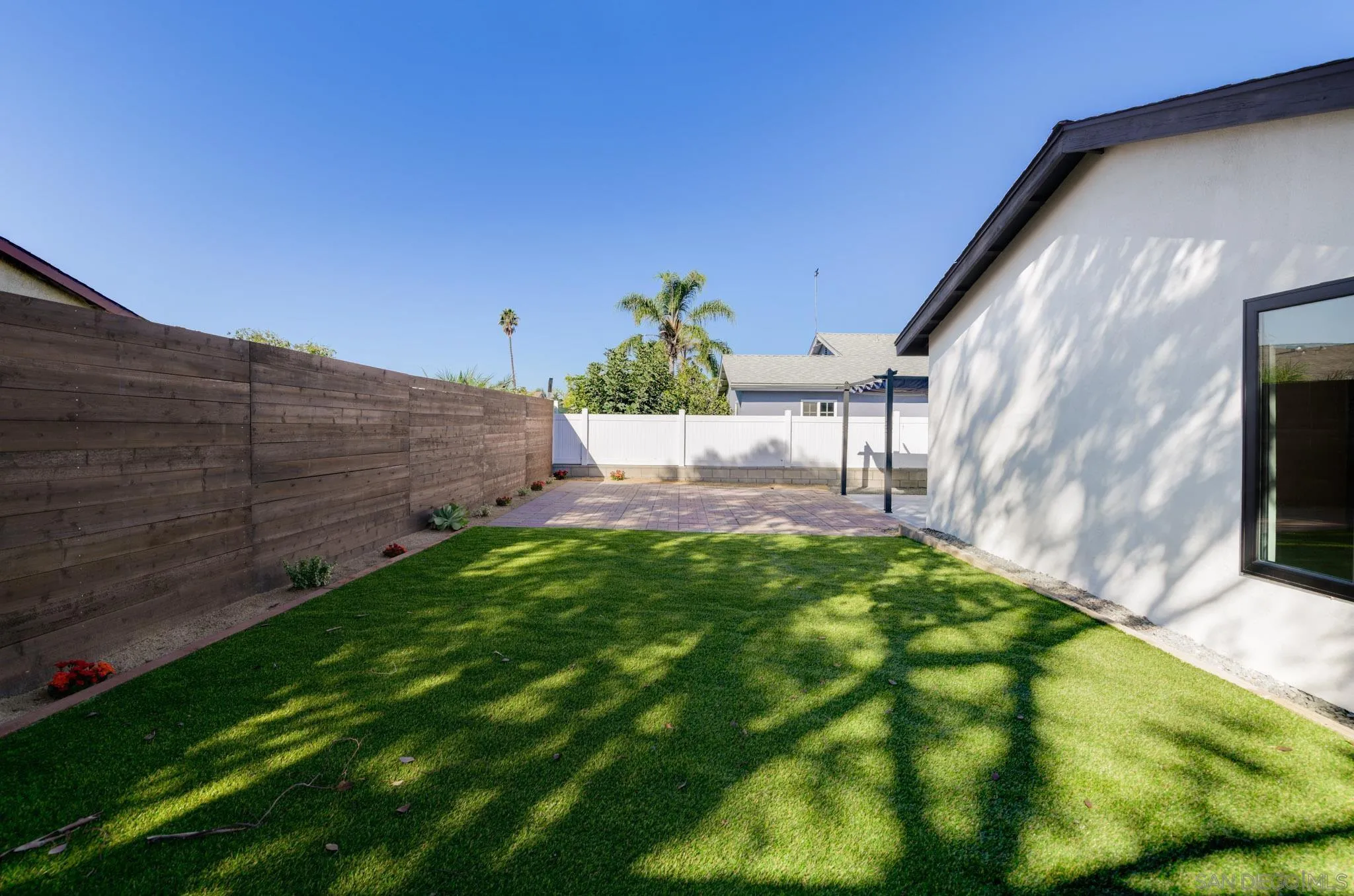 8667 Cetus Road San Diego, CA 92126 - Photo 11 of 22 a view of a pathway of a building