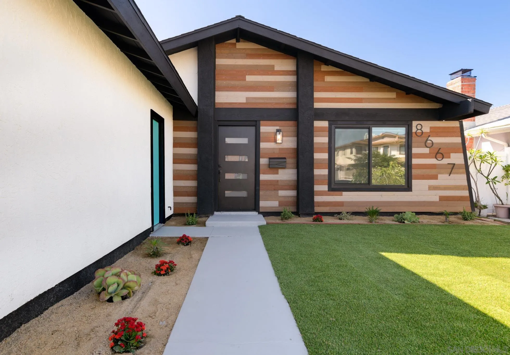 8667 Cetus Road San Diego, CA 92126 - Photo 2 of 22 front view of a house with a yard