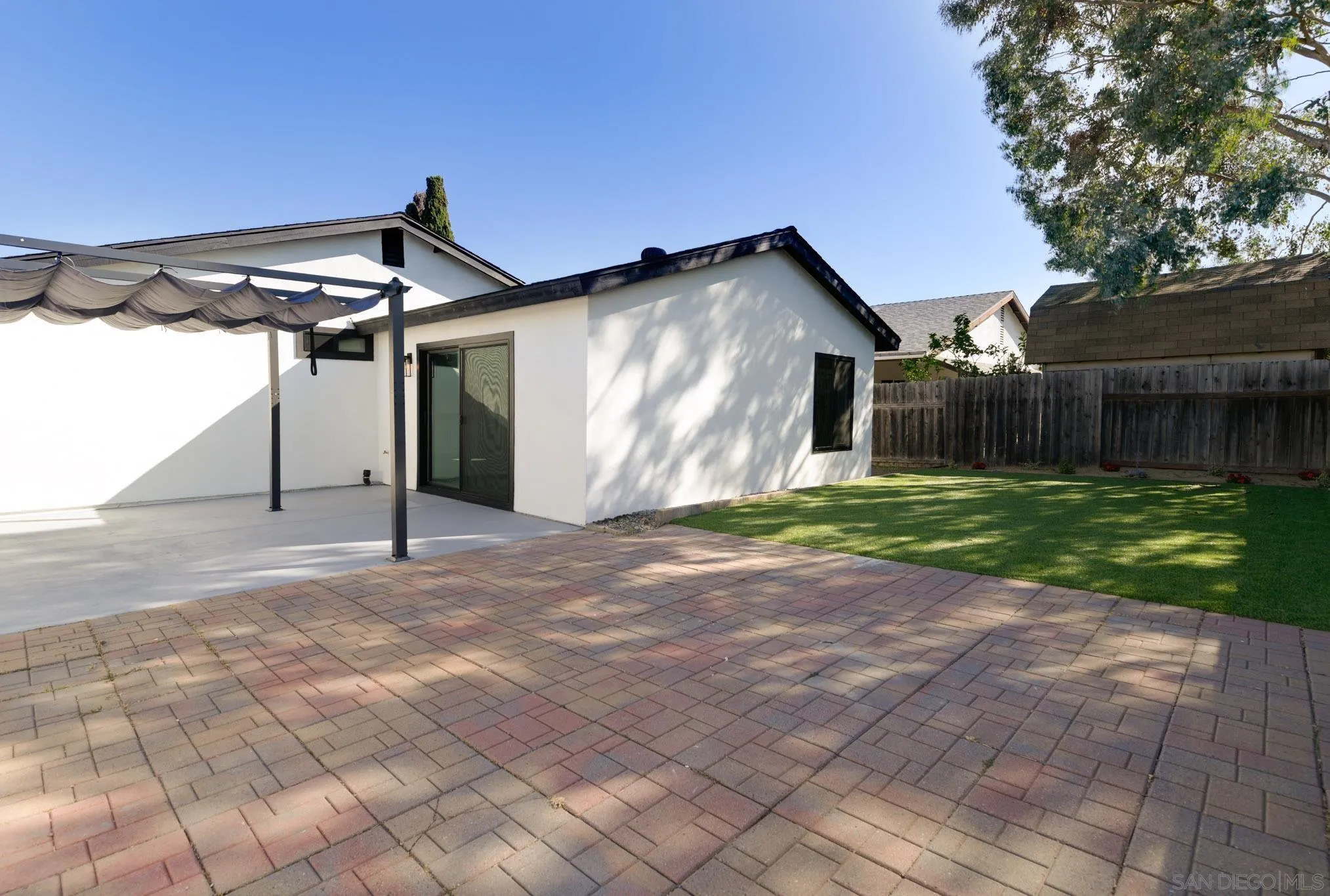 8667 Cetus Road San Diego, CA 92126 - Photo 10 of 22 a view of a house with backyard and a yard