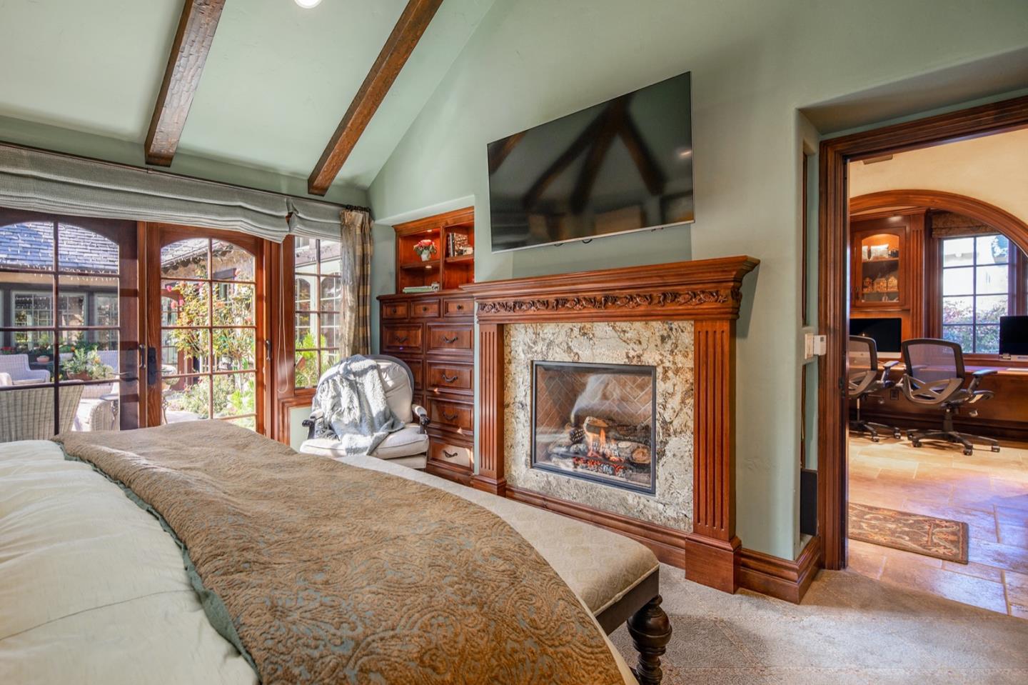 0 Casanova & 12th Corner Carmel, CA 93923 - Photo 16 of 30 a bedroom with a bed and a fireplace