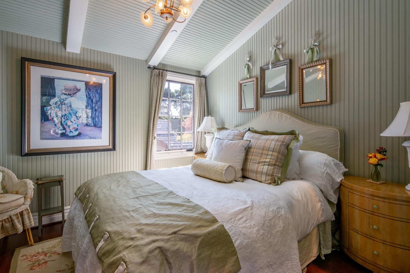 0 Casanova & 12th Corner Carmel, CA 93923 - Photo 21 of 30 a bedroom with a bed and a painting on the wall