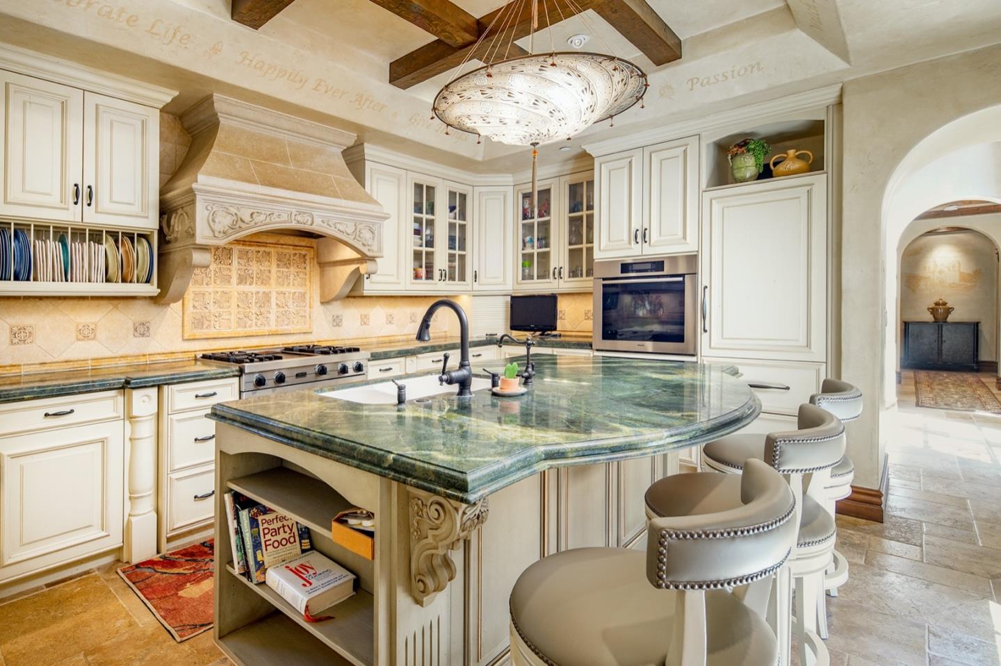 0 Casanova & 12th Corner Carmel, CA 93923 - Photo 10 of 30 a kitchen with a stove and a chandelier