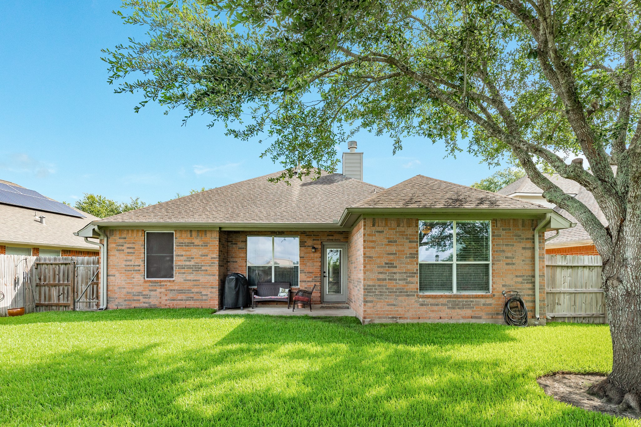 13808 Stark Bridge Lane Rosharon, TX 77583 - Photo 3 of 39 Spacious covered patio overlooks a massive, private backyard featuring mature trees that provide plenty of shade. This tranquil outdoor space is perfect for entertaining or relaxing in complete privacy with no rear neighbors.