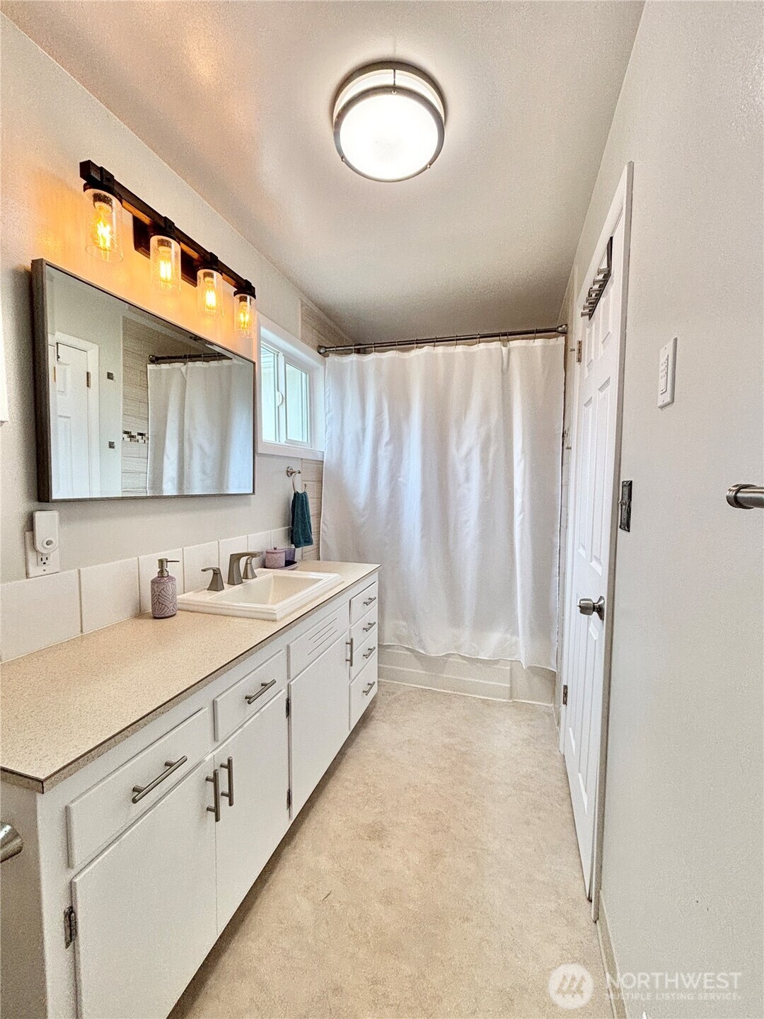 2452 Aldergrove Road Ferndale, WA 98248 - Photo 12 of 37 a bathroom with a sink vanity toilet and a mirror