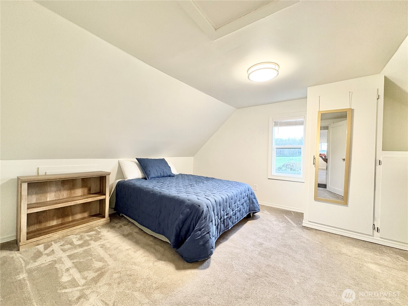 2452 Aldergrove Road Ferndale, WA 98248 - Photo 13 of 37 a spacious bedroom with a bed and a cabinets