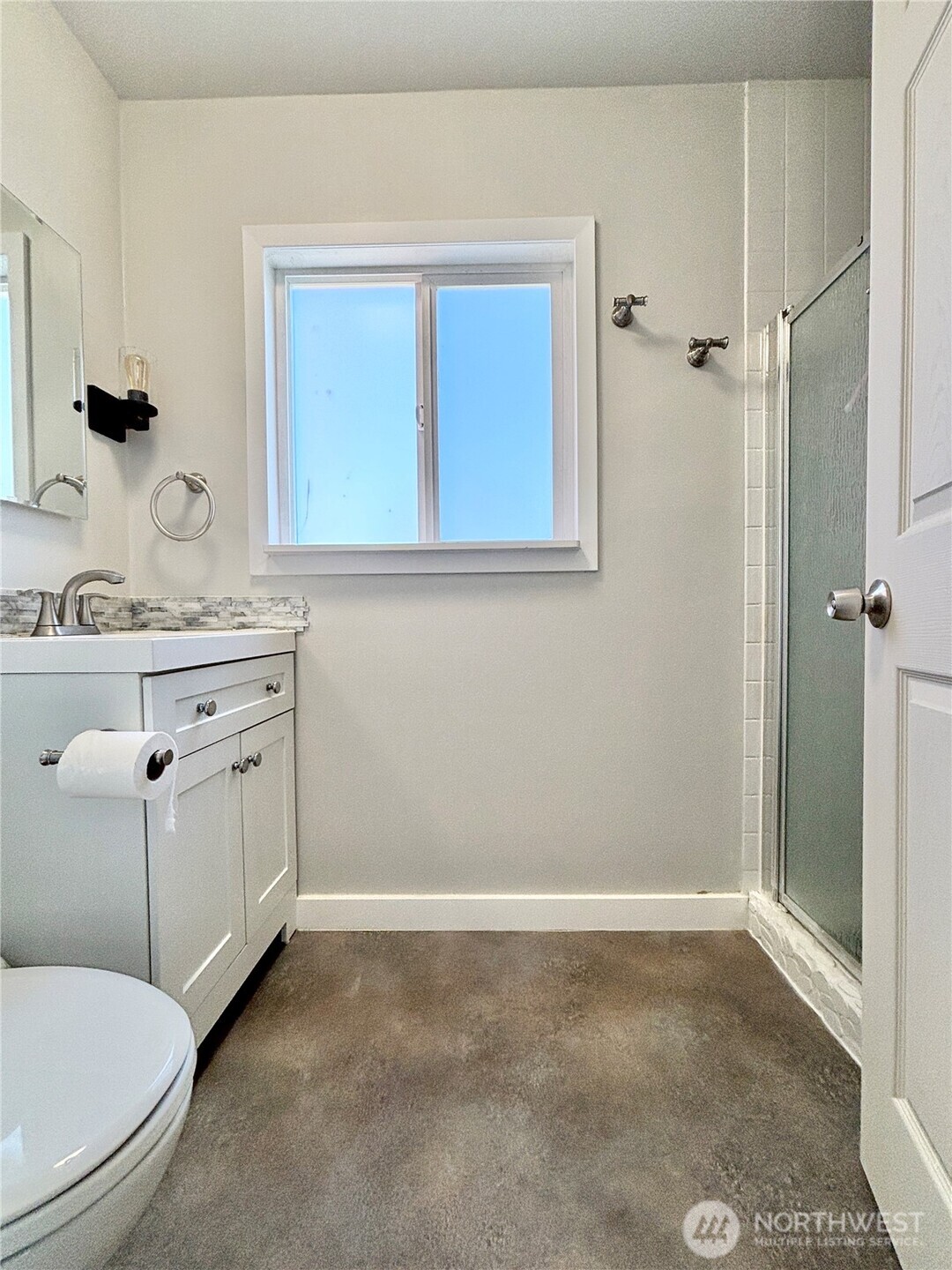2452 Aldergrove Road Ferndale, WA 98248 - Photo 16 of 37 a bathroom with a sink a toilet and shower